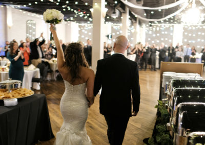 bride and groom bouquet up